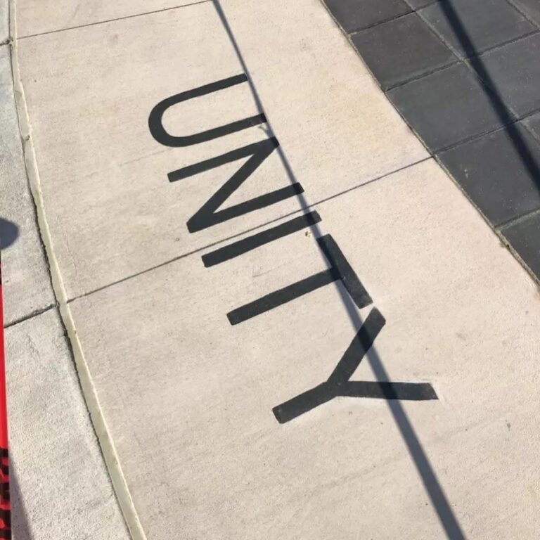 UNITY ENGRAVED IN CONCRETE INLAYED WITH PAINT