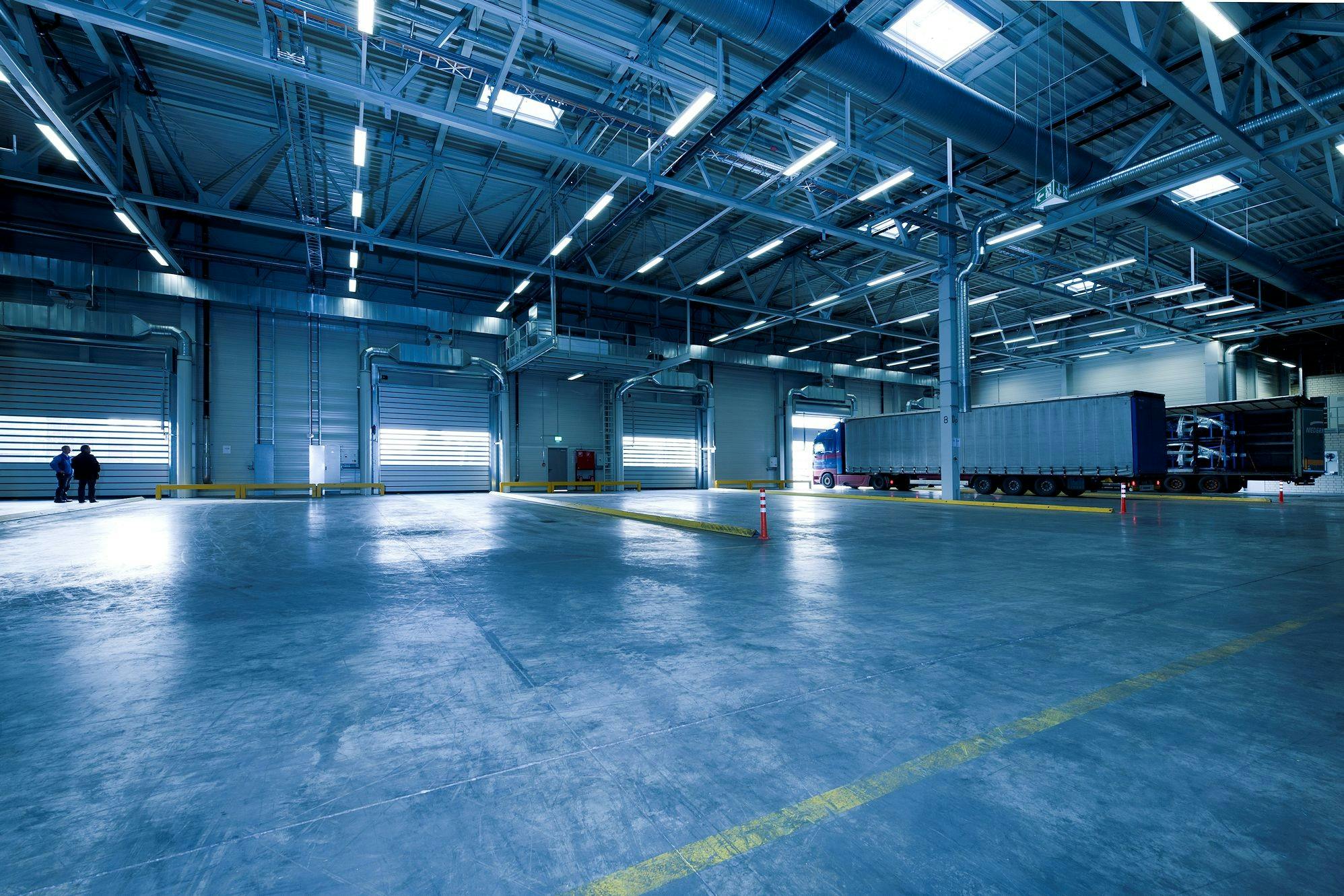 Professionally finished commercial concrete floor in a bright facility